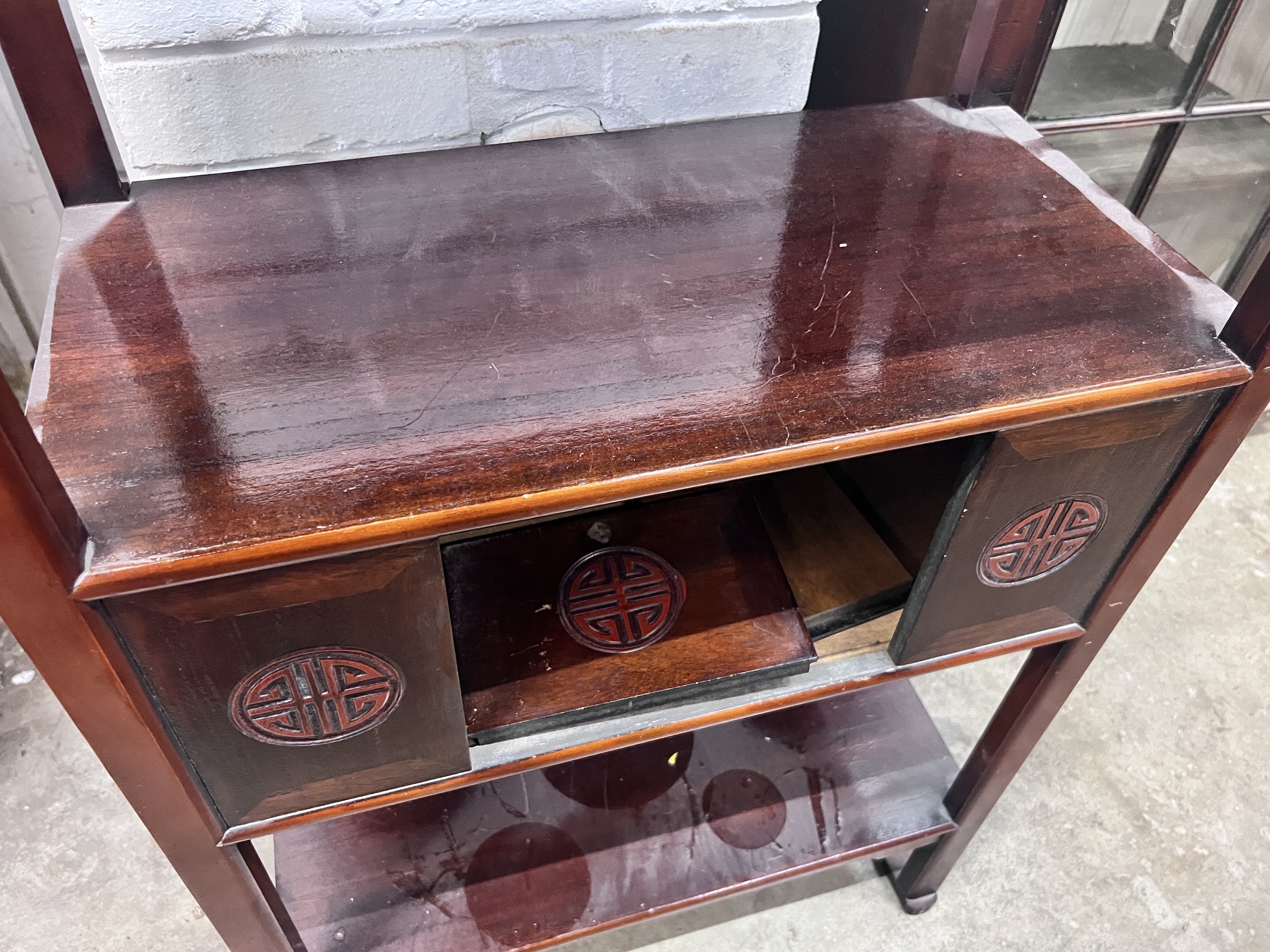 A Japanese hardwood three tier etagere, width 66cm, depth 31cm, height 98cm